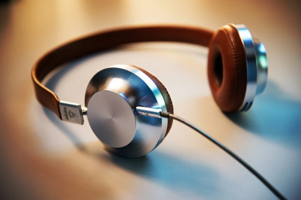 Gray and brown corded headphones